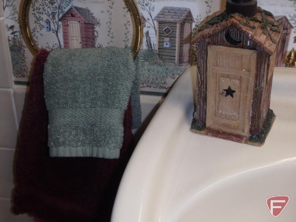 Bathroom rugs, wicker stool, metal tissue cover, soap dispenser, and cup holder, candles,