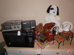 Sanyo microwave, Samsung portable television/radio, GE electric radio, wicker chest, wall clock,