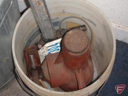 Metal garbage can, sweeping compound, shelf brackets, floor jacks, stove pipe, black paper,