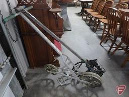 Seed planter and vintage cultivator. Both.