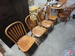 Wood table 53inL with (2) 12in leaves. (6) matching chairs.