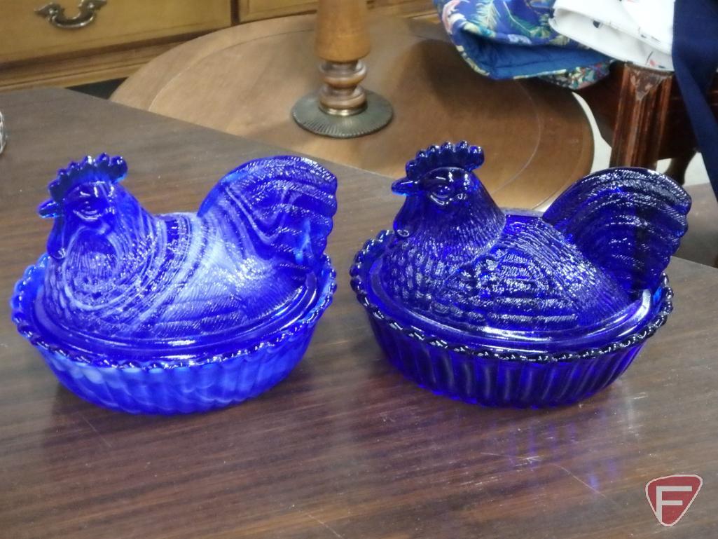 Glass covered chicken dishes, blue, blue/white swirl, and amber, metal wall decoration, ceramic