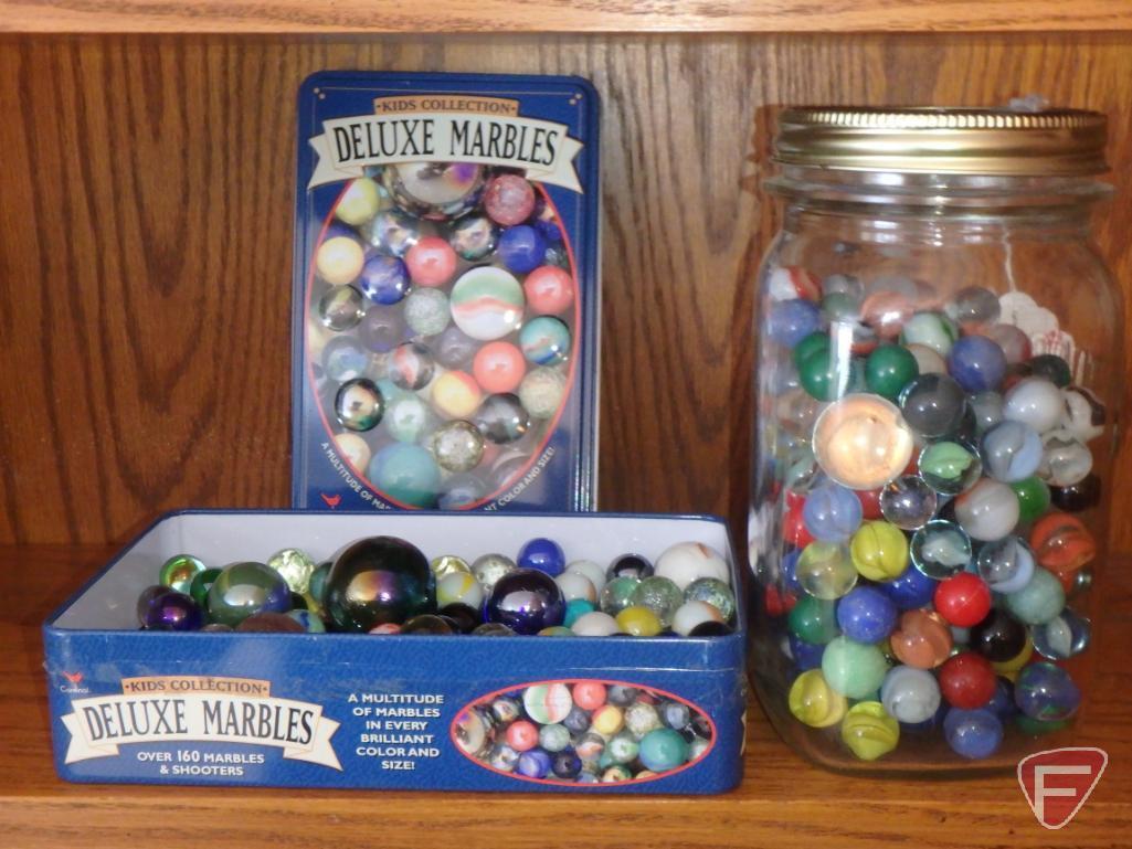Canning jar and metal tin with marbles