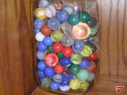 Canning jar and metal tin with marbles