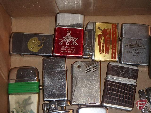 Cigarette lighters, some with advertising