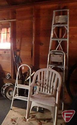 Contents of east wall: hand saw, barometer clock, shepherd hook, 48" aluminum step ladder,