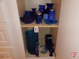 Cobalt blue dishes: salt and pepper, sugar, bowls- both shelves