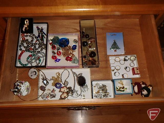 Jewellery: bracelets, lapel pins, necklaces, rings, earrings, metal compact, and watches