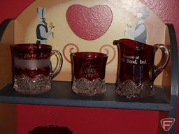 Ruby glassware, most with advertising: cream pitchers, mugs, toothpick holders, South Bend Indiana