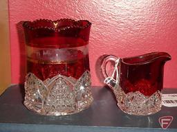 Ruby glassware, most with advertising: cream pitchers, mugs, toothpick holders, South Bend Indiana