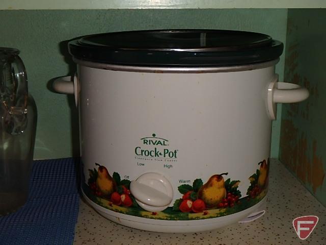 Contents of cuphord: Holt Howard mugs, Rival crock pot, plastic picnic dishes, Corelle dishes,