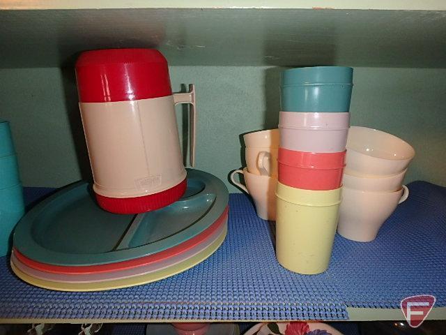 Contents of cuphord: Holt Howard mugs, Rival crock pot, plastic picnic dishes, Corelle dishes,