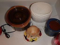 Rival small crock pot, biscuit jar, Rachel Ray oil cruet, candles, silverware utensils, plastic