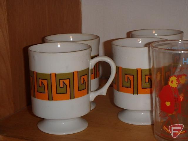 Corelle dishes, juice glasses, mugs, (2) Archie glasses; includes 4 shelves with blue items