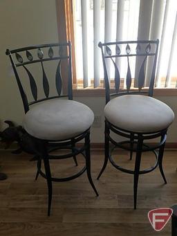 Pair of bar stools, black metal leaf design with tan cushion