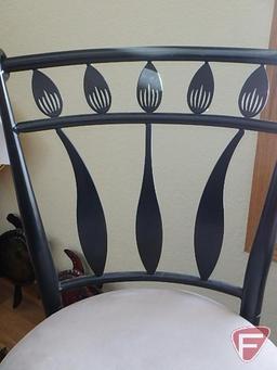 Pair of bar stools, black metal leaf design with tan cushion