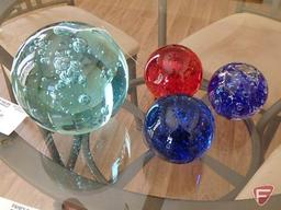 4 glass ball paperweights of various sizes