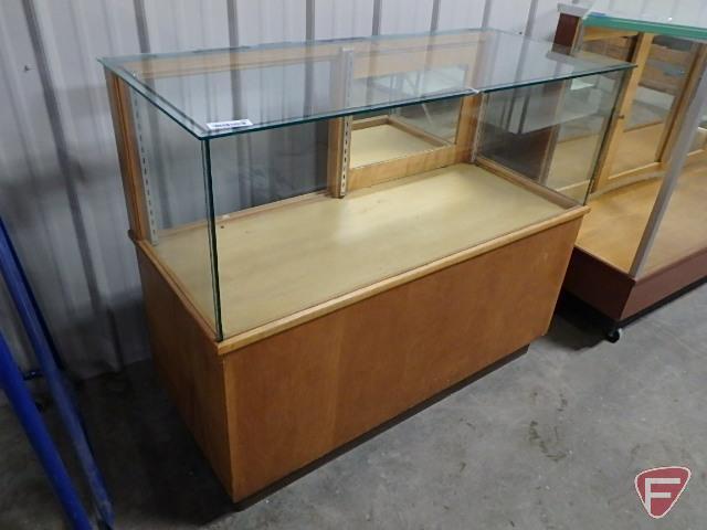 Glass display case, mirrored sliding doors, bottom storage in back, adjustable shelving,