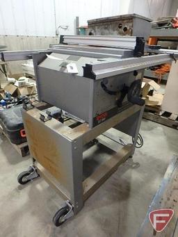 Ryobi BT3000 10" table saw on metal stand with electrical box