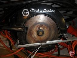 Black & Decker circular saw, Black & Decker drill, and extension cords