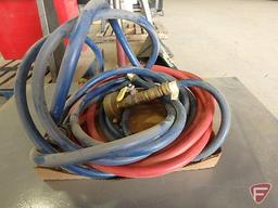Bosch Aquastar gas water heater in Zumro case, with hoses