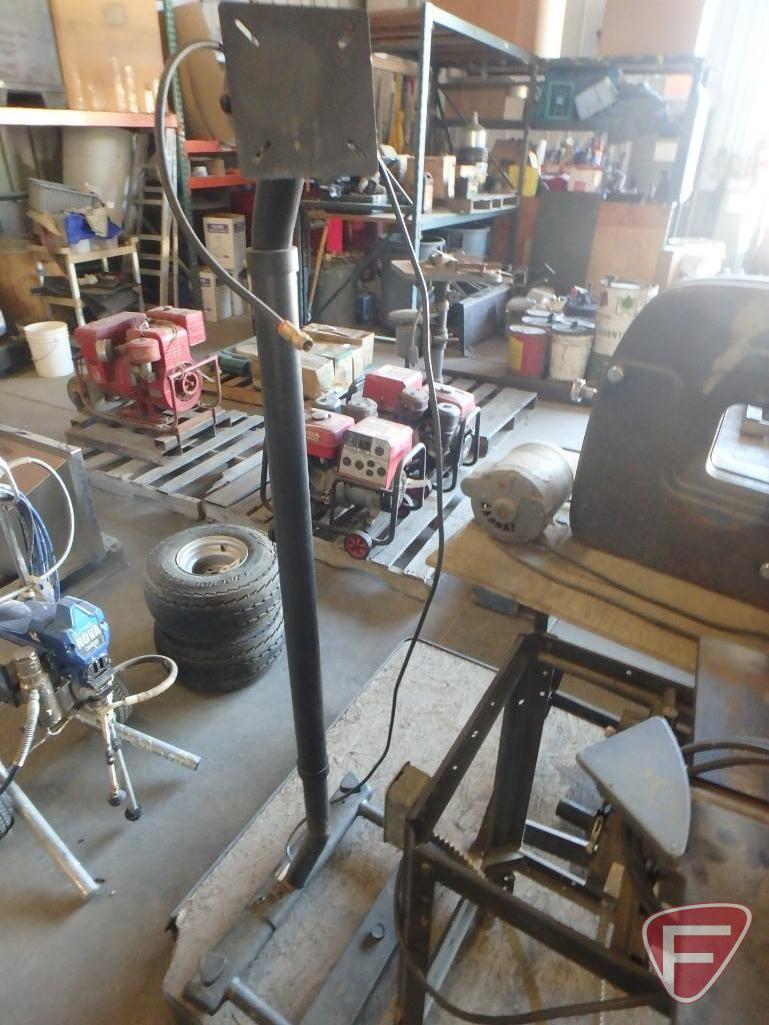 Jointer on stand, Craftsman skil saw on stand, and work light stand