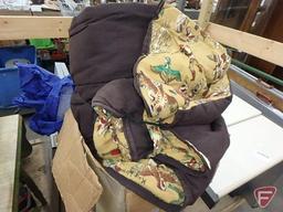 Vintage sleeping bag, vintage chair/step stool, and rain suit.