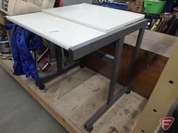 Adjustable work table on wheels