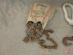 Various rope and chain, garden tools, pots, baskets, hand saws, root feeder. Both totes, one has lid