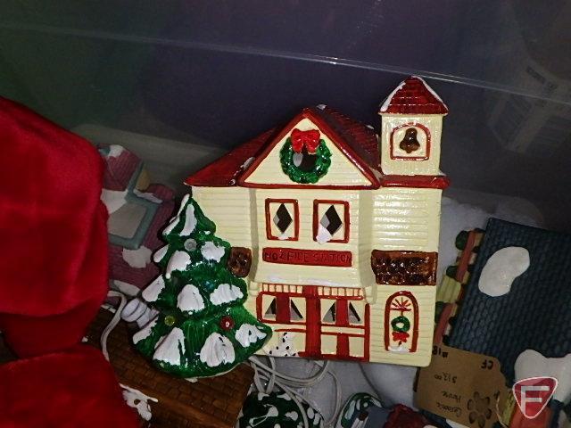Holiday/Christmas items. Vase, candle holders, lights, figurines, stockings, village pieces.