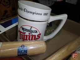 Sports memorabilia. Wheaties boxes in acrylic cases, Kirby Puckett pennant, Twins mug,