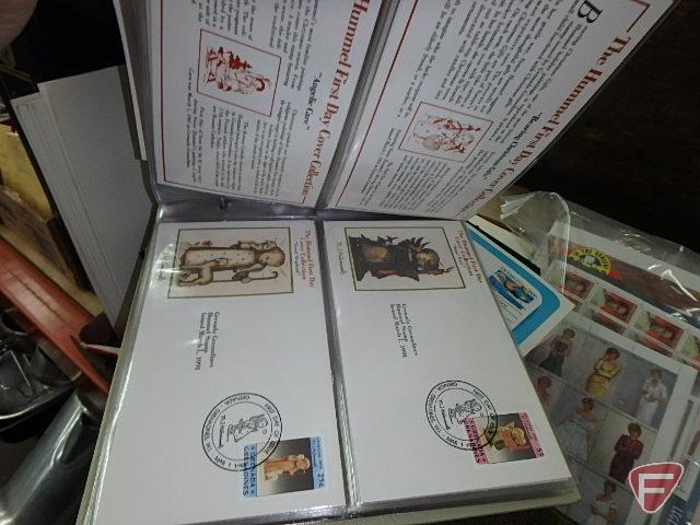 Large collection of stamps, some first day issue in binder, collection of postcards and matchbooks.