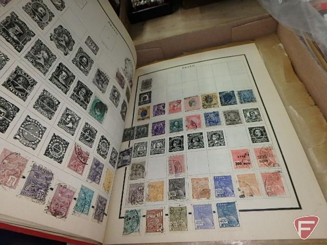 Large collection of stamps, some first day issue in binder, collection of postcards and matchbooks.