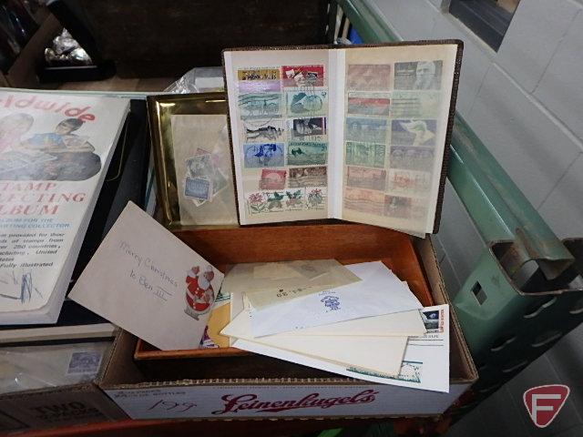 Large collection of stamps, some first day issue in binder, collection of postcards and matchbooks.