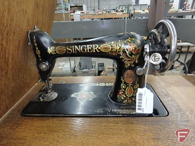 Singer treadle sewing machine in cabinet