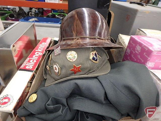 Military jacket, skirt, hat, helmet and Girl Scout sash.