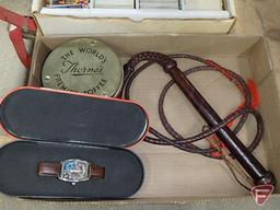 Lone Ranger wrist watch, Justrite Cigars and Canadian Mountie tins, leather whip