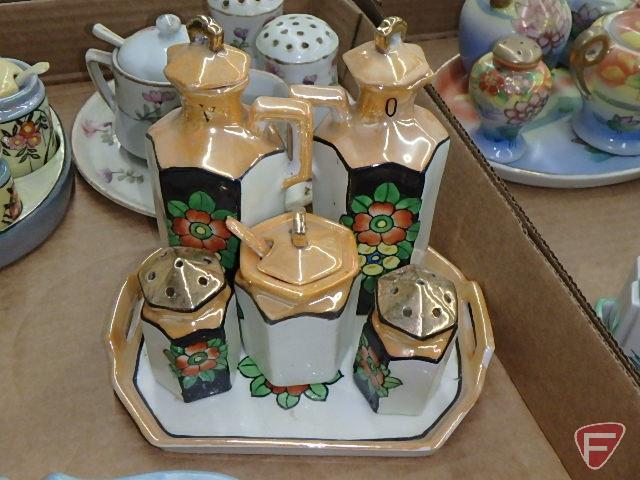 Porcelain condiment sets. Contents of 2 boxes