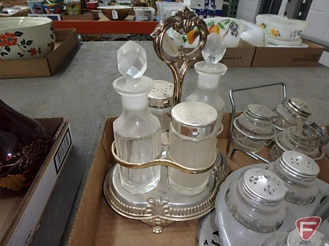 Clear glass condiment sets in metal holders and on glass trays, measuring cup, refrigerator dishes.