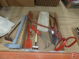 Ice tongs, one Chaska brick, garden tools, hose nozzle, stained Glencoe feed sack