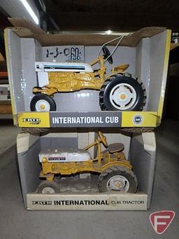 International Cub tractors, no. 14339 and no. 653, soiled