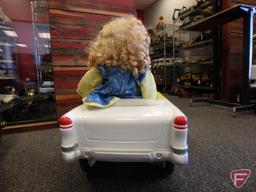 Yellow and white two tone pedal car with doll