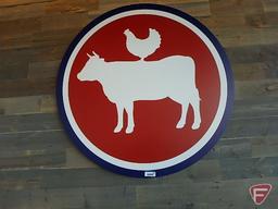 Cow sign with chicken jockey silhouette sign