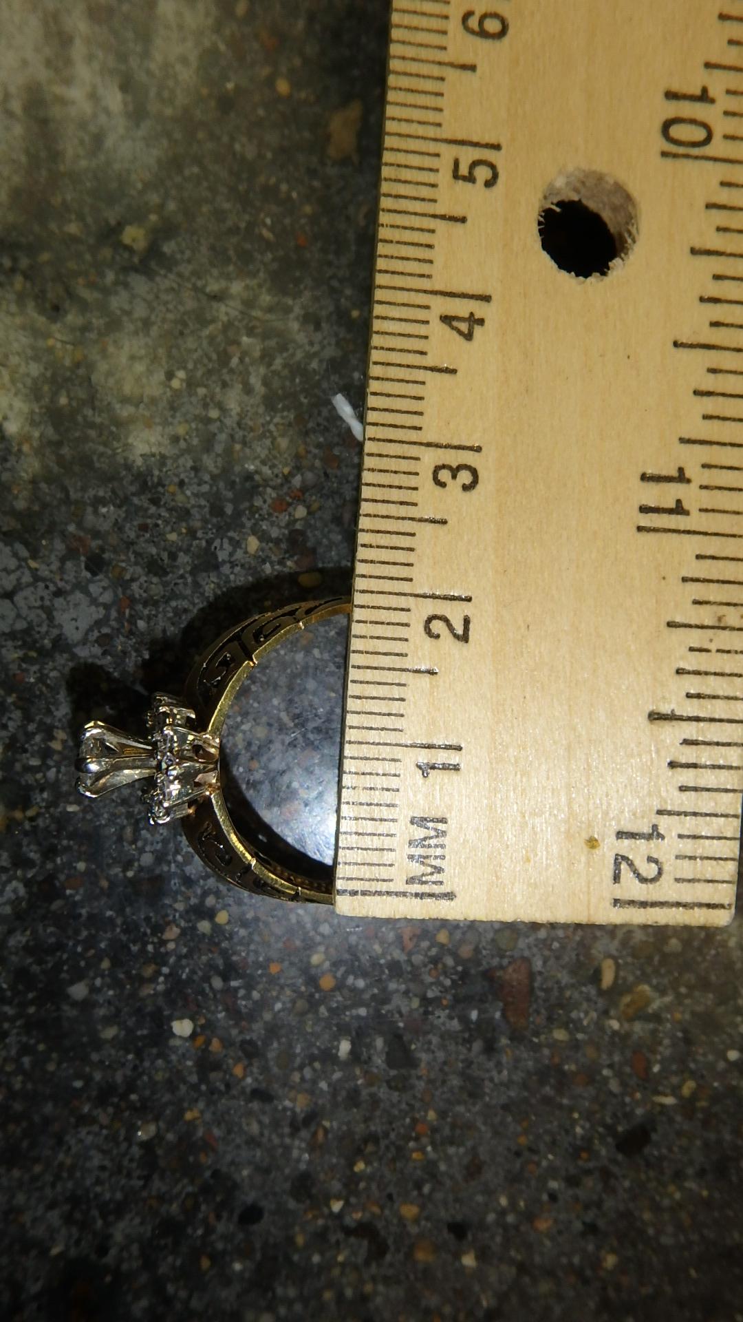 Ladies 14 K yellow gold diamond ring, center stone marquise cut Diamond .34 Pt. TW.; accent stones