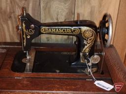 Damascus treadle sewing machine in cabinet, 23-1/2"x18"x29"H