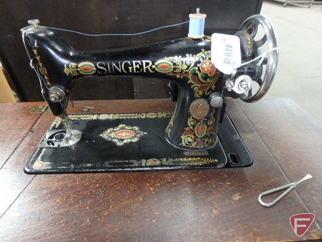 Singer treadle sewing machine in wood cabinet