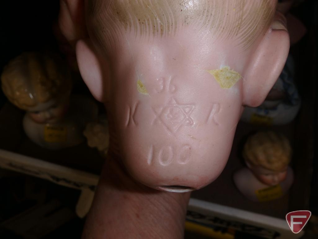 Doll parts, porcelain/ceramic heads, porcelain eyes, porcelain/ceramic limbs.