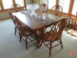 Wood table 42inx66in with (2) self-contained leaves, 2 extra leaves and (6) matching wood chairs.