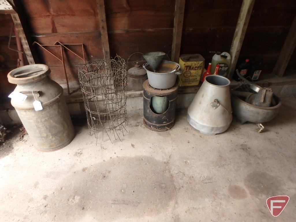 Milk can, milk pail, metal garden fencing, funnels, kerosene jars, cow bell, heater,