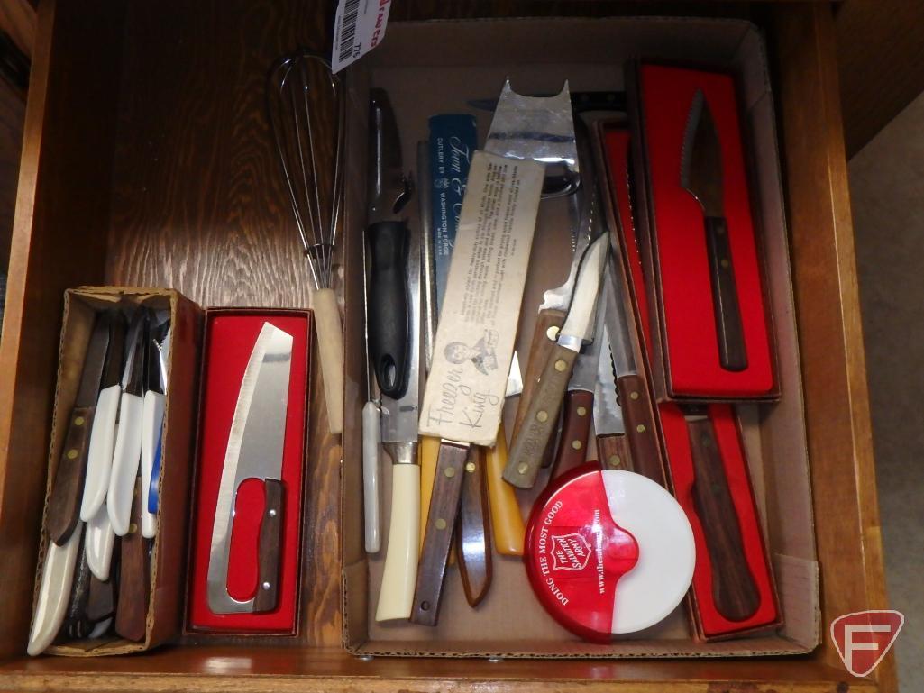 Assortment of silverware, not matching, potholders, knives, kitchen utensils. All 4 drawers